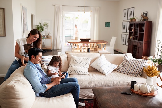 young family in living room reviewing options for certificates of deposit