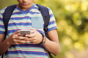 young person texting on a smart phone