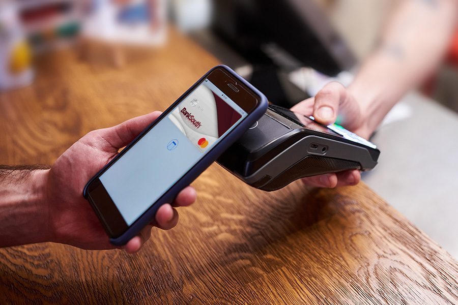 person paying using mobile wallet