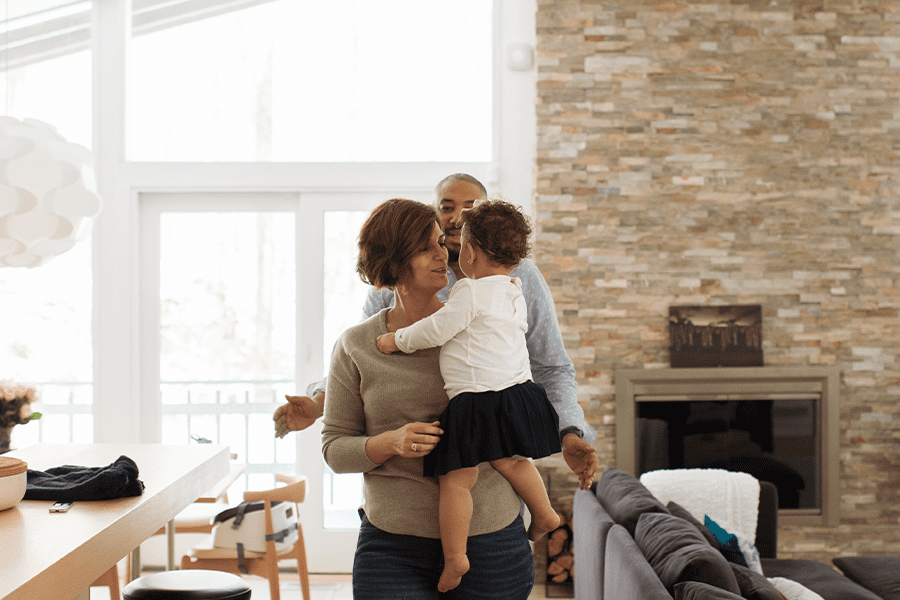 family walking in their new home