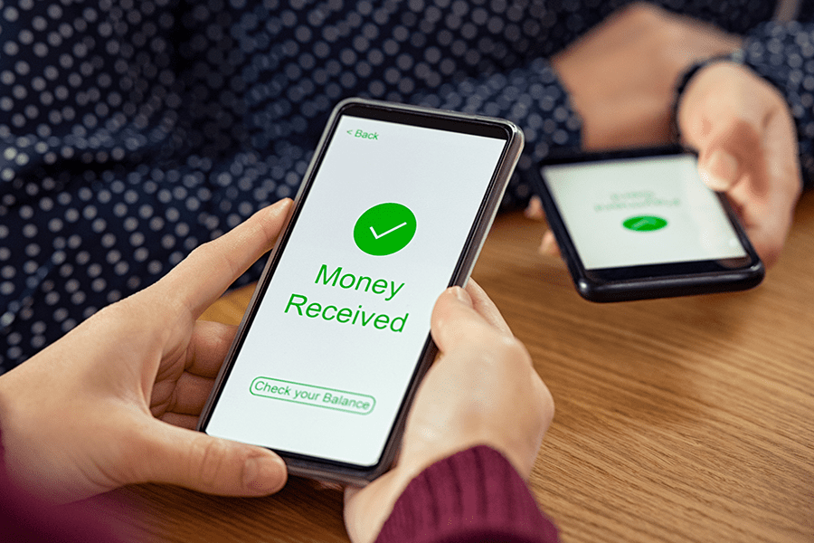 woman sending money through authorized push payment
